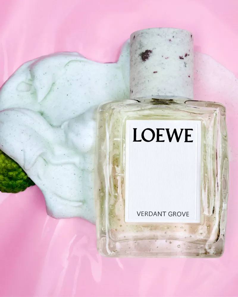 Image series showing still-life perfume bottles with granite caps alongside raw botanical ingredients, pigment powders, and fresh citrus slices.