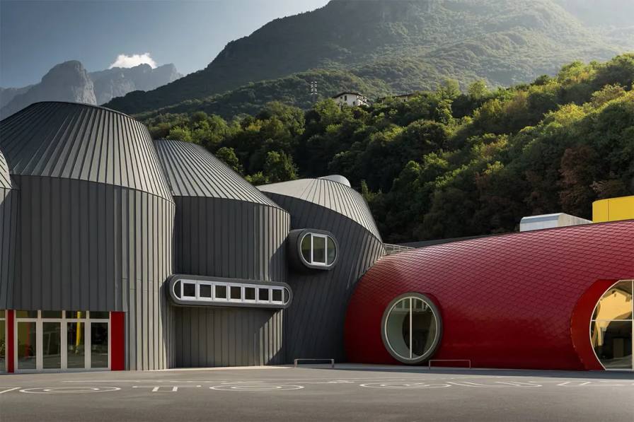 MOTO GUZZI OPENS GREG LYNN MUSEUM IN MANDELLO image of the opening of the new Moto Guzzi factory and museum in Mandello del Lario. The article details the architectural design by Greg Lynn and the features of the new facility.