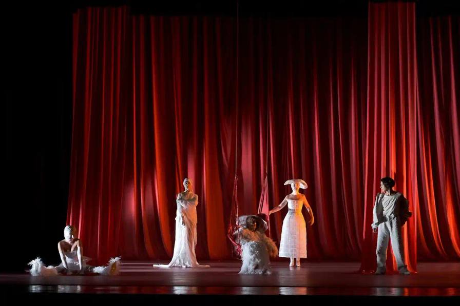Theater performance examining matriarchal family structures and female inheritance through personal narrative and costume design.
