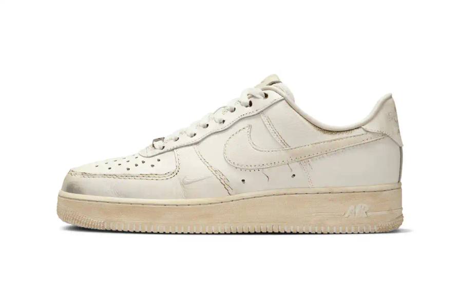 NIKE'S UNIQUE TWIST: "DIRTY" AIR FORCE 1 LOW SNEAKERS REVEALED image of details Nike's upcoming "Dirty Triple White" Air Force 1 Low sneakers, which feature an innovative design that appears worn when new but becomes cleaner with use. The article covers the release through Nike's .SWOOSH platform, mentions the included toothbrush for cleaning, and notes the May 7 US-only release date via the SNKRS app. The piece provides context about Nike's previous digital-physical crossover releases and explains the concept behind this unconventional approach to the classic silhouette.