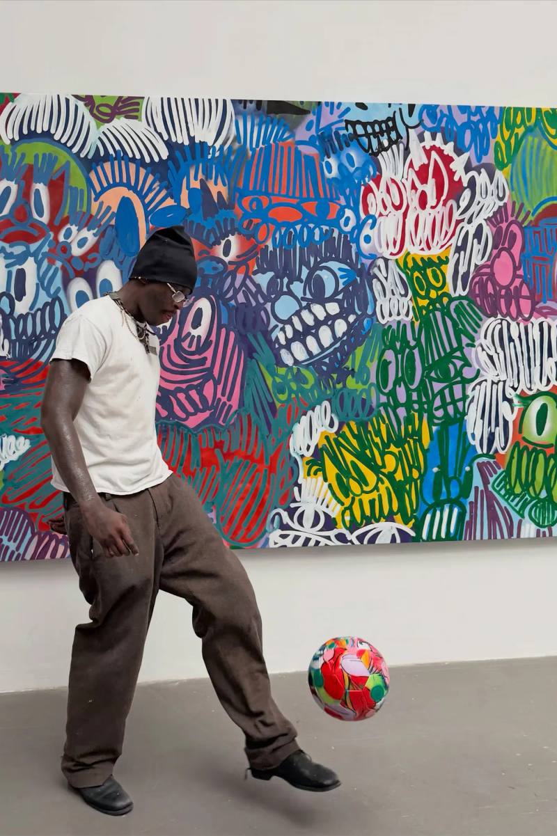 image description detailing London artist Olaolu Slawn's debut New York pop up art exhibition including large scale paintings and sportswear apparel.