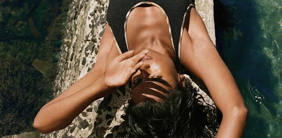 This image details a clothing collaboration between Burberry and Hunza G focusing on single size swimwear.