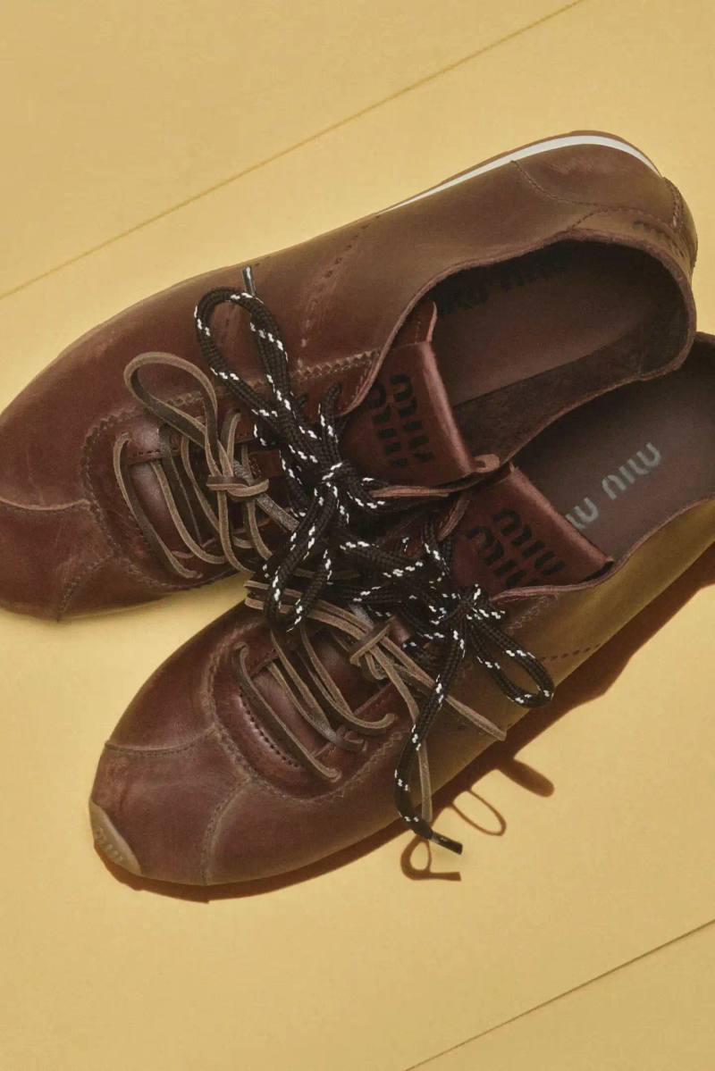 MIU MIU OPENS 2026 WITH PRELUDE COLLECTION Miu Miu introduces Prelude collection for 2026, featuring workwear-inspired pieces, two new sneaker models with customization options, and a range of bags and ready-to-wear items.