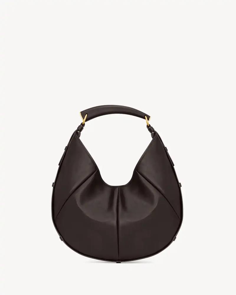 SAINT LAURENT BRINGS BACK THE MOMBASA BAG image about Saint Laurent relaunching its Mombasa bag design from 2002 for the Spring 2026 season in multiple sizes and materials.