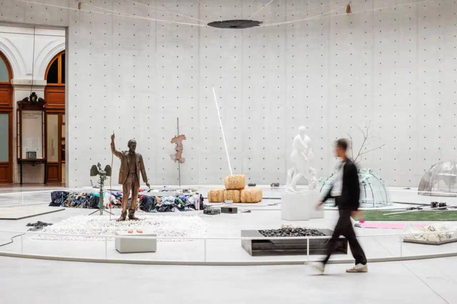 Entrance to Arte Povera exhibition at Bourse de Commerce showing exhibition title and dates