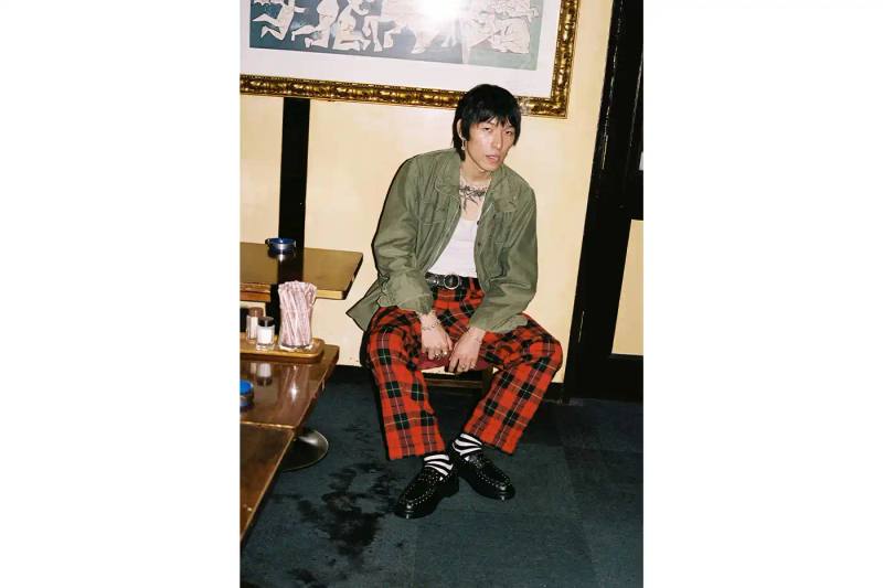 SUPREME TEAMS WITH DR. MARTENS ON EXCLUSIVE PENTON LOAFERS image of the Spring 2025 collaboration between Supreme and Dr. Martens featuring Studded Penton Loafers. The piece describes the three colorways (black, red, and green), the distinctive metal stud detailing around the shoes, co-branded footbeds, and AirWair® cushion soles. Release dates are May 22 for global markets and May 24 for Asian markets, available through Supreme's website and physical stores. The article also briefly mentions Supreme's recent footwear collaborations with Vans and Nike.