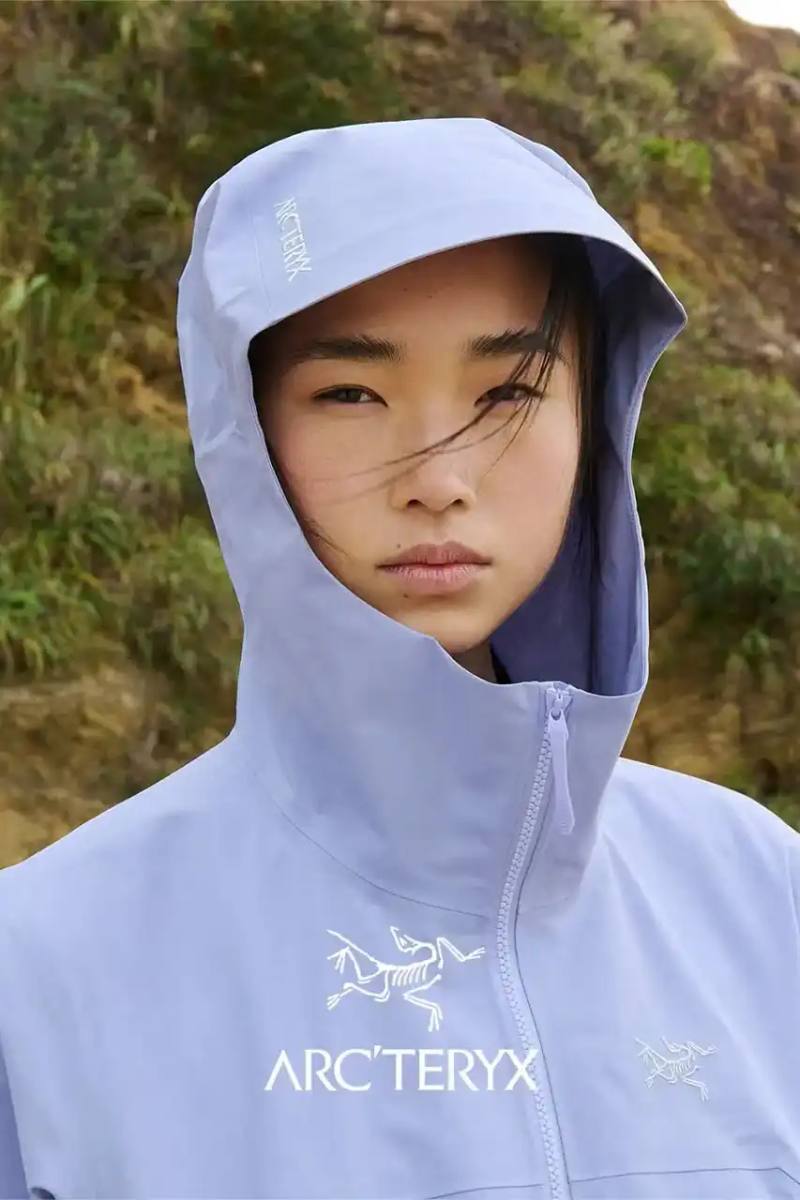 ARC'TERYX x BEAMS BOY Twilight Trail collection featuring lavender and yellow Beta Jackets, Squamish Hoodies, Mantis 1 Waist Packs, and Mantis 26 Backpacks arranged on a neutral background.