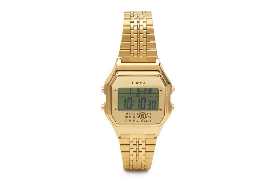 MM6 MAISON MARGIELA AND TIMEX RETURN WITH GOLD T80 COLLECTION MM6 Maison Margiela partners with Timex for a second collection featuring gold-tone versions of the T80 digital watch and ring watch, available from November 17th.