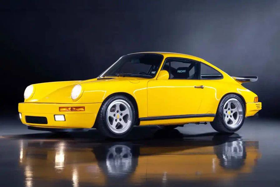 Yellow 1989 RUF CTR Yellowbird parked at Gooding & Company's Amelia Island Auction before its record $6M sale.