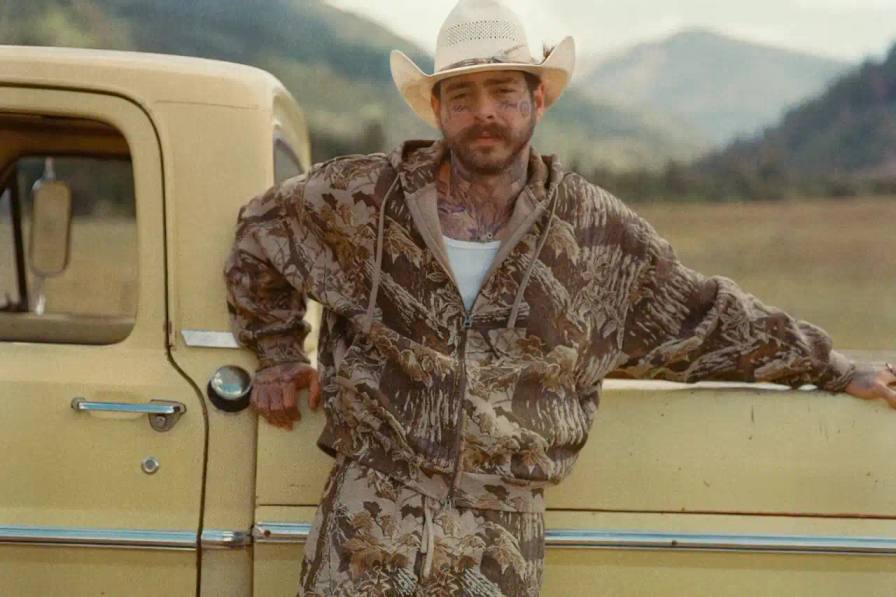 Post Malone photographed wearing SKIMS menswear including camouflage patterns and fleece clothing for brand campaign.