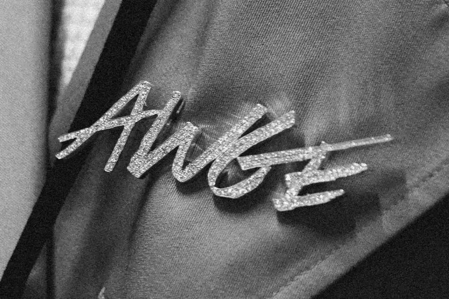 A$AP ROCKY'S AWGE COLLECTION NOW AVAILABLE THROUGH CASH APP image reports on a retail collaboration between musician A$AP Rocky and Cash App. It describes clothing items and accessories from Rocky's AWGE collection now available through Cash App's Afterpay service, including a parka he wore to the Met Gala, designer hoodies, and a diamond-studded brooch. The article provides price range information ($50-$4,000) and notes the items are available in limited quantities through AWGE's website.