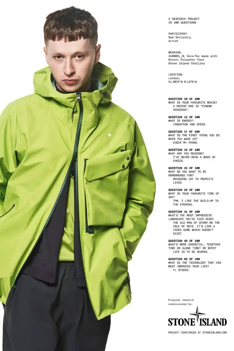 Stone Island Stellina lime green technical jacket with GORE-TEX membrane. Worn by model, featuring raglan sleeves, detachable chest pocket, and adjustable hood and hem. Made from recycled BIONIC™ polyester with a technical, modern silhouette.