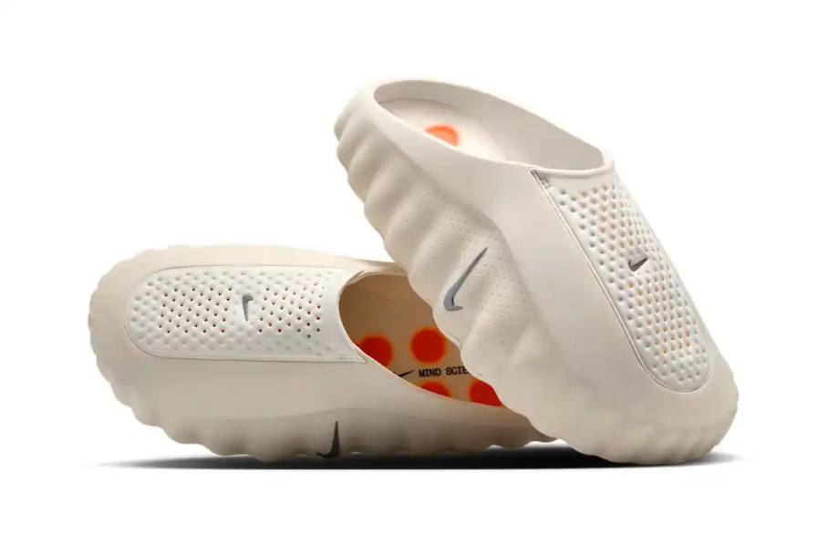 Nike releases new Mind 001 mule in Light Bone colorway featuring foam nodes designed to stimulate foot sensors, priced at $130, available January 2026.