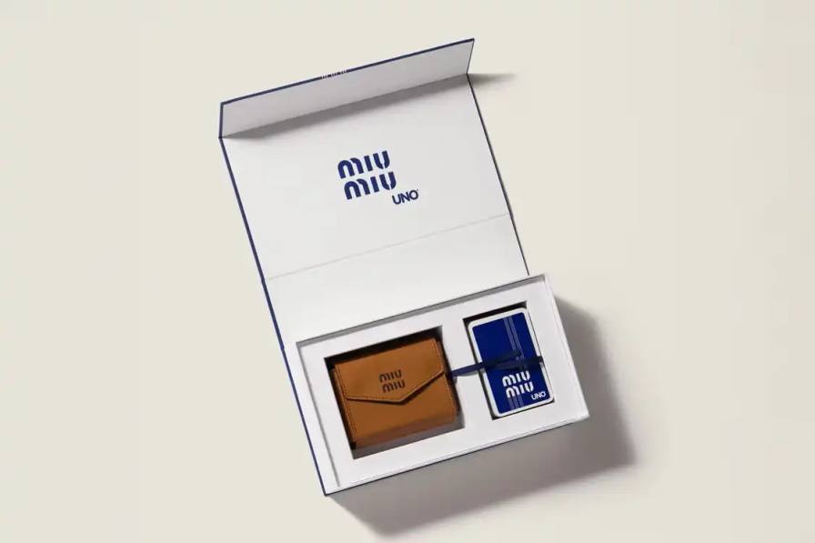 MIU MIU X UNO CARD GAME SET RETAILS FOR $600 Miu Miu releases a collector's edition UNO card set for $600, featuring custom artwork and a leather case in Cognac and Palisander colors.