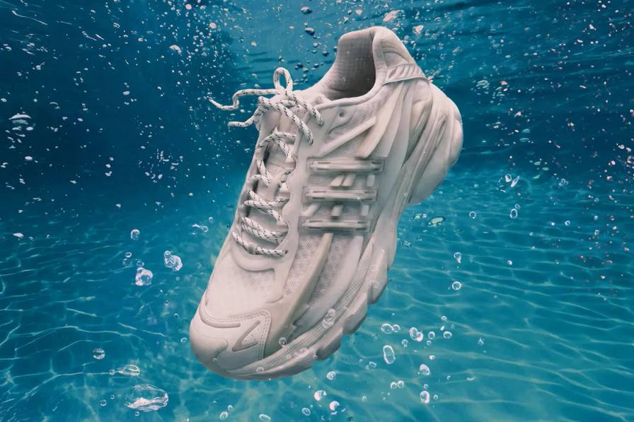 Plain white background showing the all-white adidas VIRGINIA Adistar Jellyfish sneaker with a caged upper and thick wavy sole.