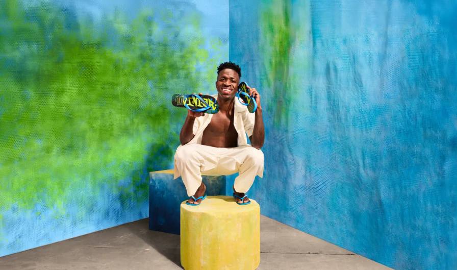 An image detailing the new Havaianas shoe collection created with Brazilian football player Vini Jr, including release dates, prices, and design themes.