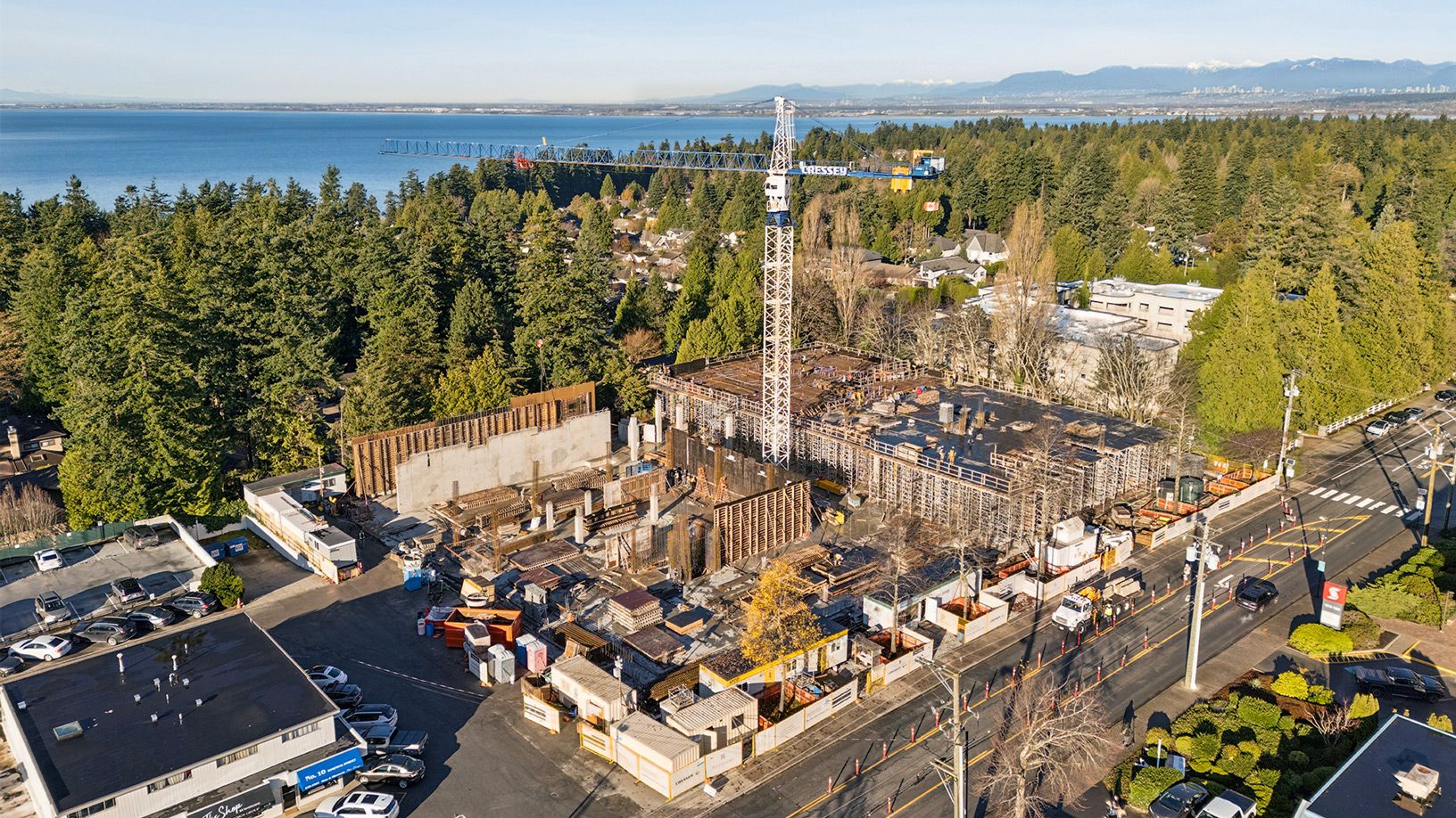 Sunrise at Rockford showcasing construction progress with crane and lush landscape
