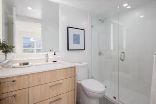 Restroom facilities with glass shower and modern feel