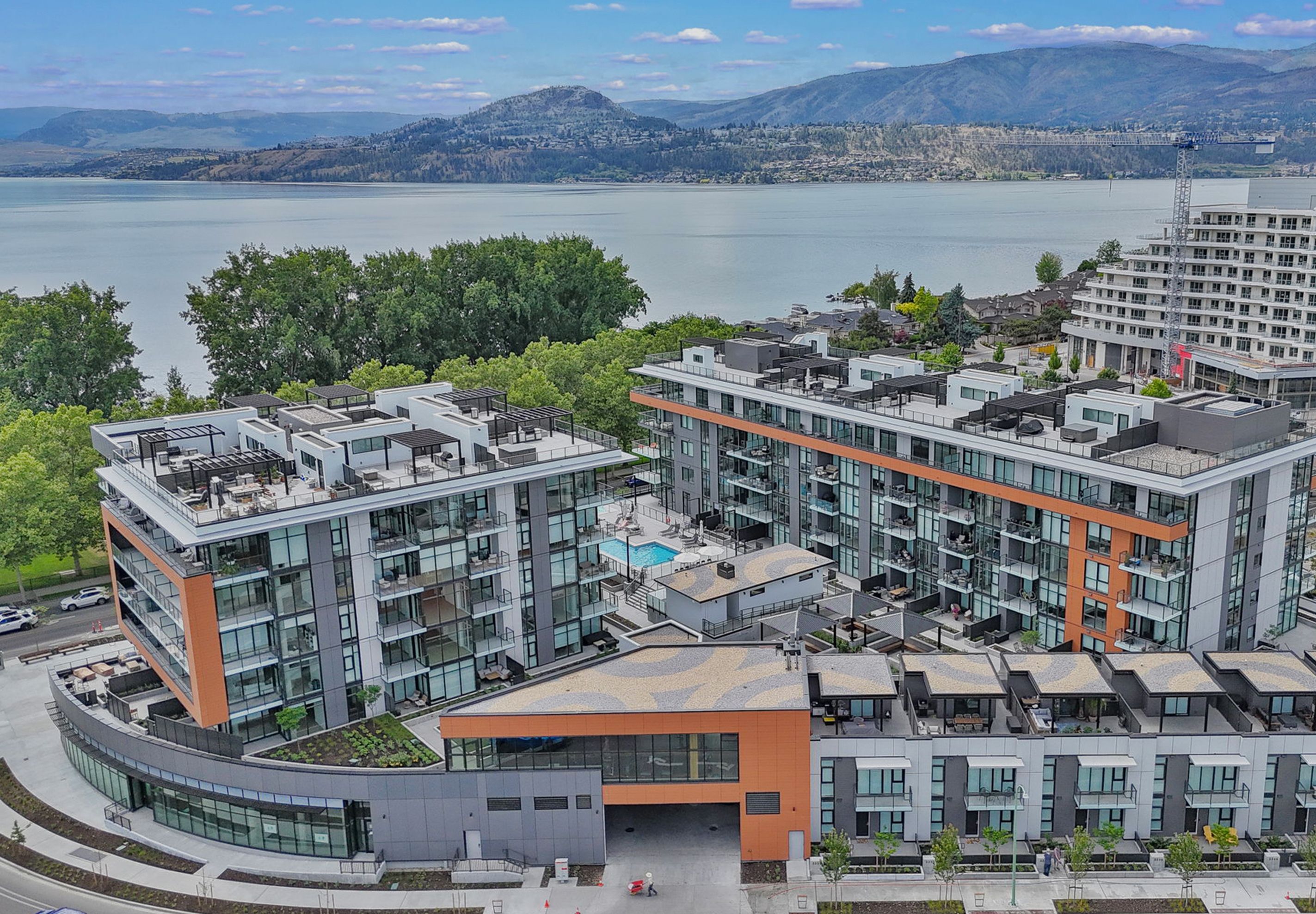 Aerial perspective of Caban by Cressey, overlooking a lake and mountain view