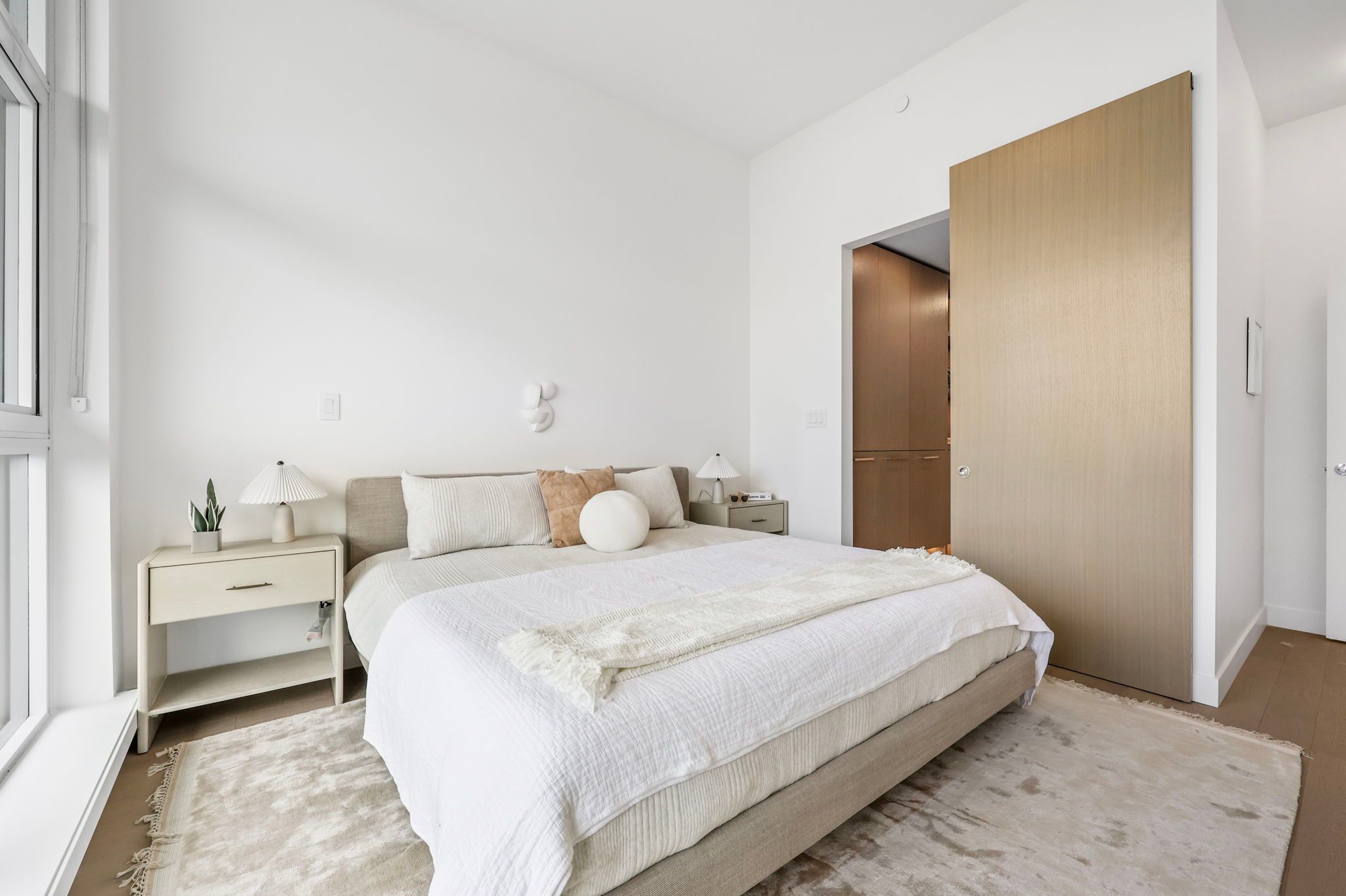 Large bedroom with sliding door open to walk-in closet