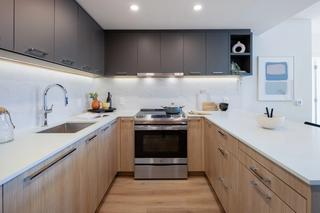 Close angle of kitchen with quartz countertops at Victor
