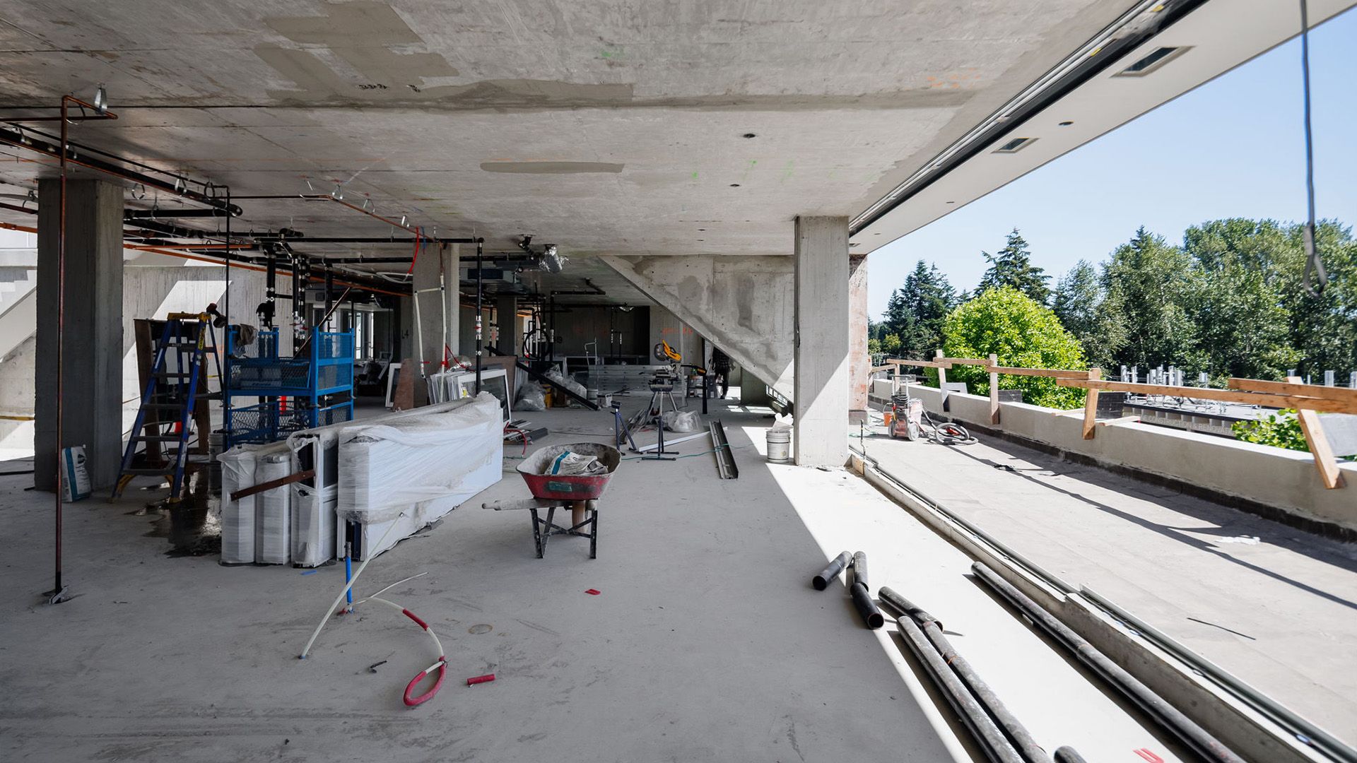 Inside of a concrete home under construction on sunny day