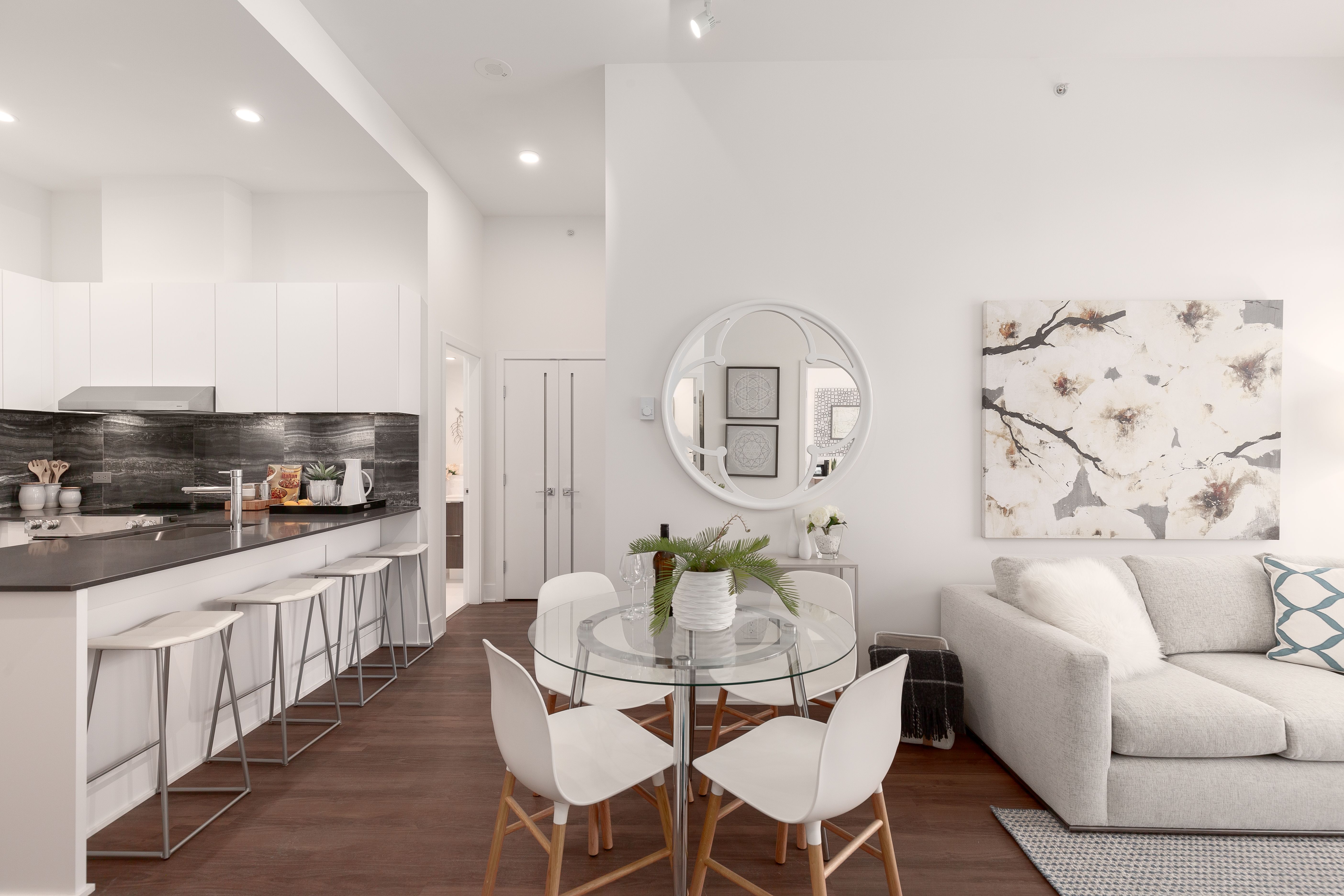 Living room with modern finishings and near kitchen with quarts countertop