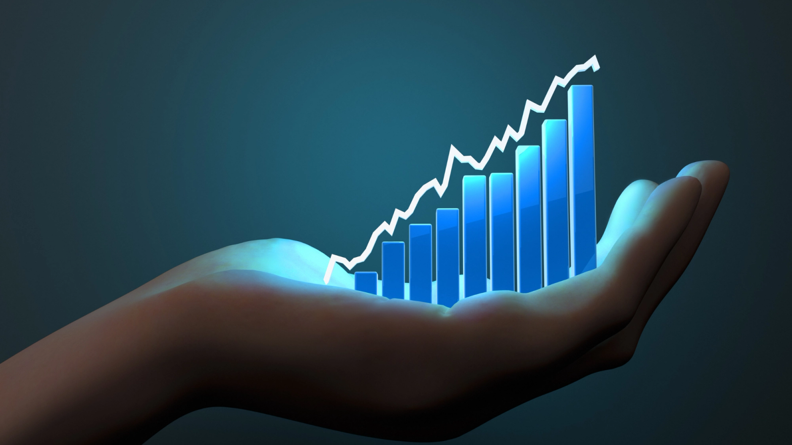 a hand holding a graph chart in the palm of the hand