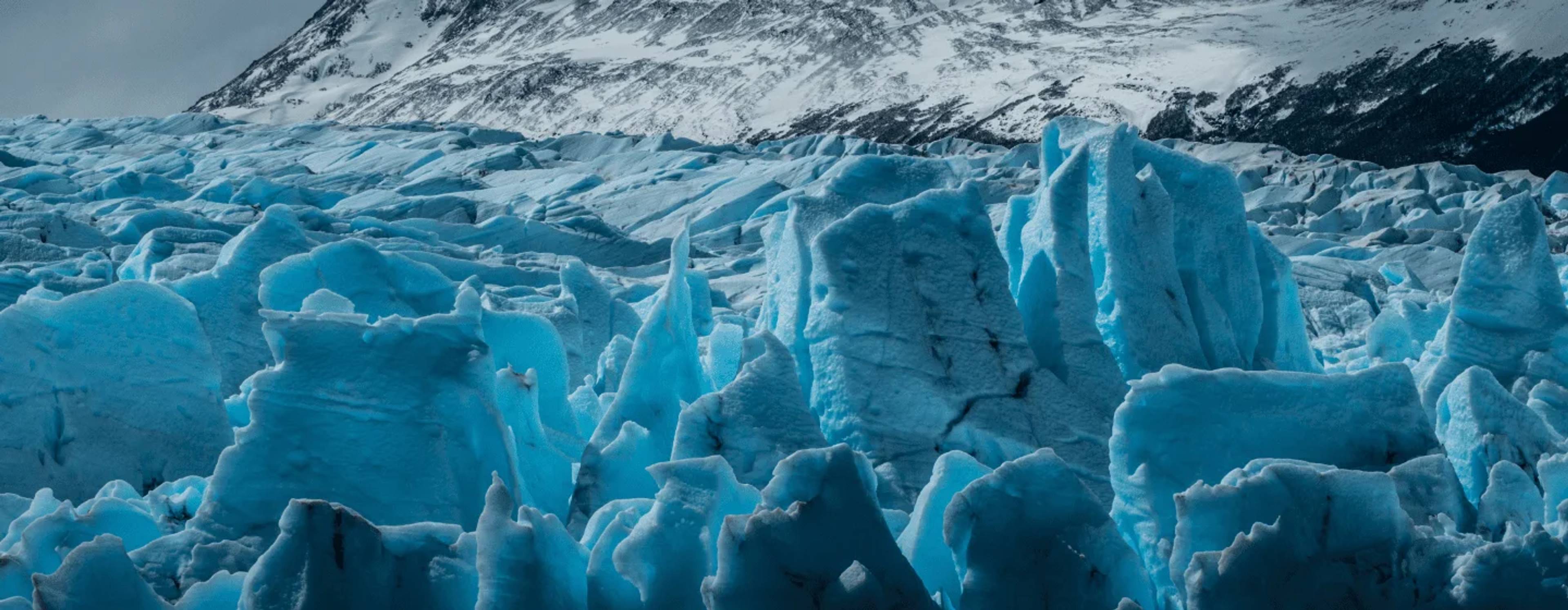 Blue ice seracs of the Grey glacier below a snow-covered ridge