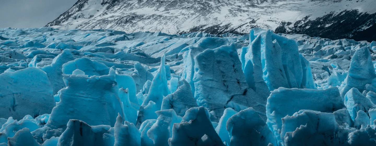 Blue ice seracs of the Grey glacier below a snow-covered ridge
