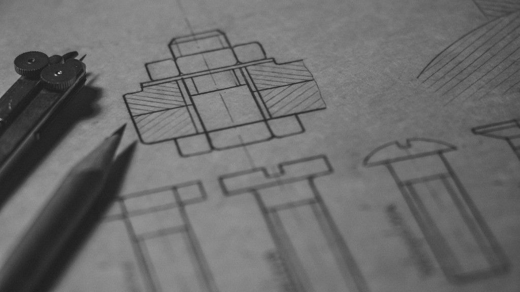 Technical blueprint drawings with drafting tools—planning, precision, and craft