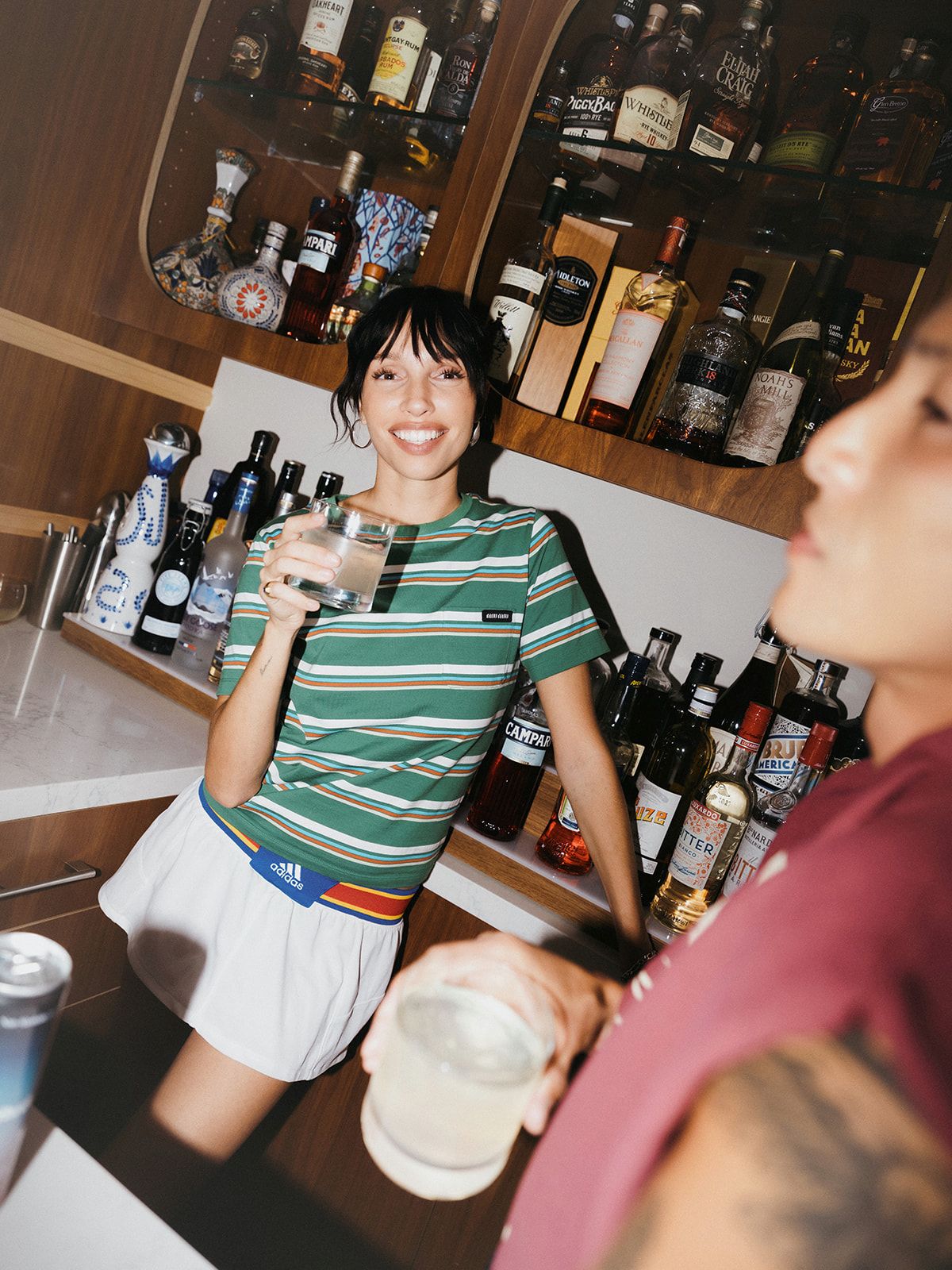 Two people drinking Altitude out of glasses