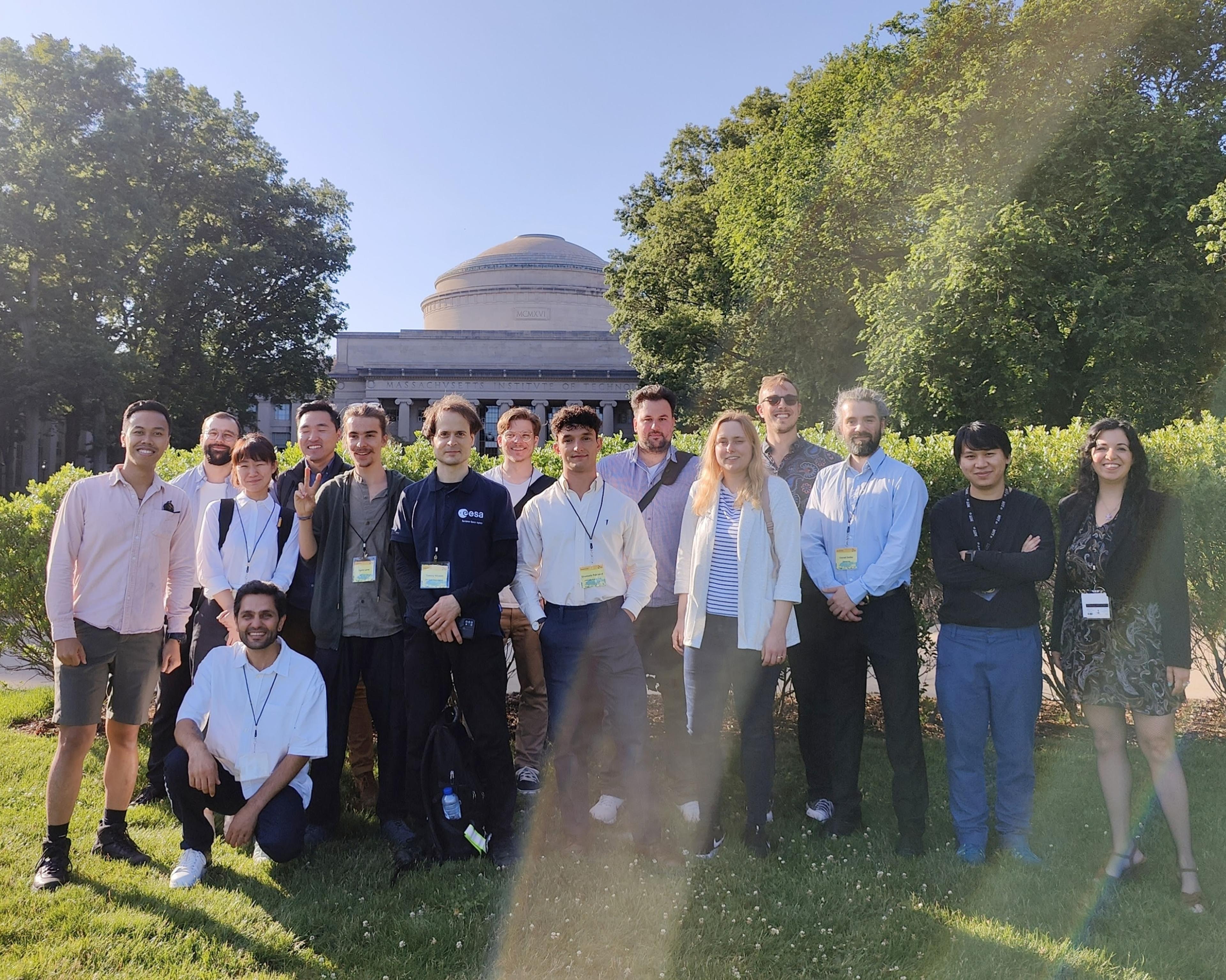 Photo of conference attendees in front of the MIT Great Dome building.