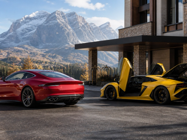Two contrasting Italian supercars being evaluated with luggage outside a mountain hotel