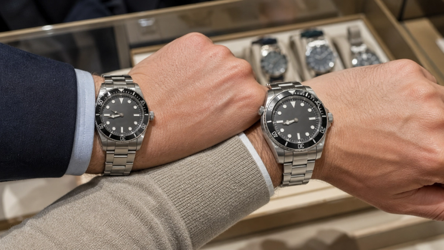 Two steel dive watches compared for wrist size and thickness