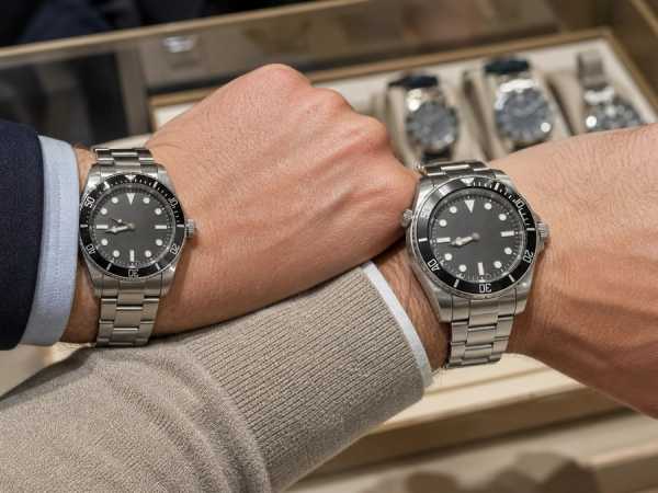 Two steel dive watches compared for wrist size and thickness