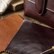 Leather grain and edge construction beside a luxury accessory