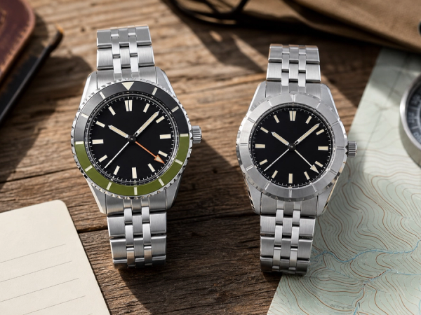 Rotating-bezel and fixed-bezel dual-time watches compared for travel and expedition use
