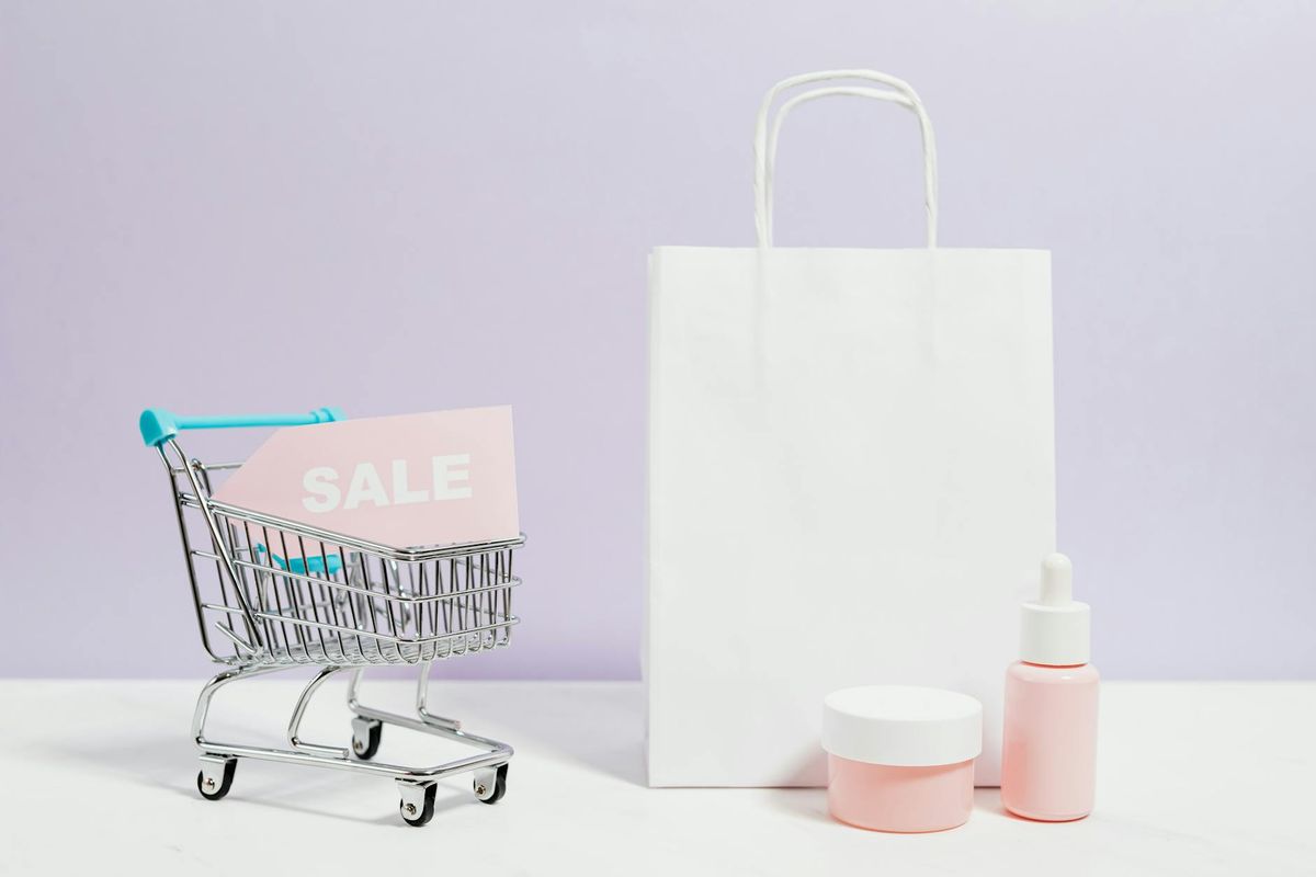 Aesthetic shopping scene with a white bag, cart, and cosmetics on sale.