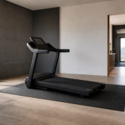 Home treadmill positioned with safe clearance in a bright apartment room