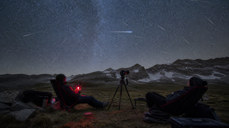Dark-sky camp prepared for the 2026 Perseid meteor shower with chairs, red light and camera tripod