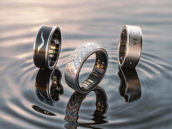 Three VERTU AI Aura Rings on water — black, diamond pavé, and silver — official product photography for the Care Five-Piece Set