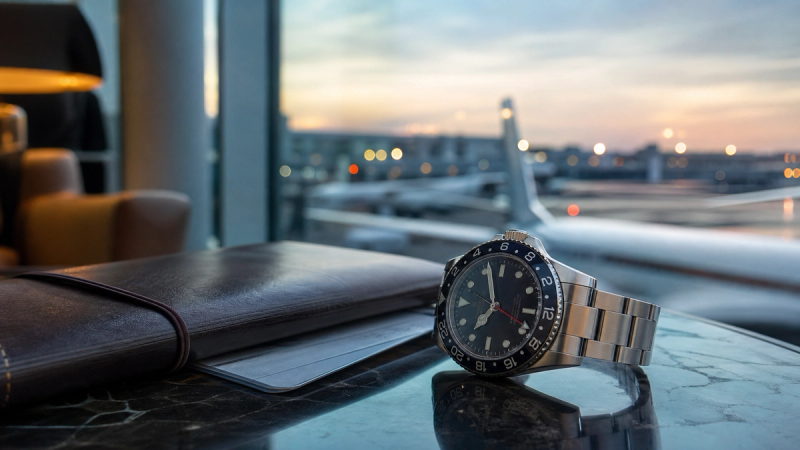 A sophisticated wearable device on a person's wrist in a luxury setting.