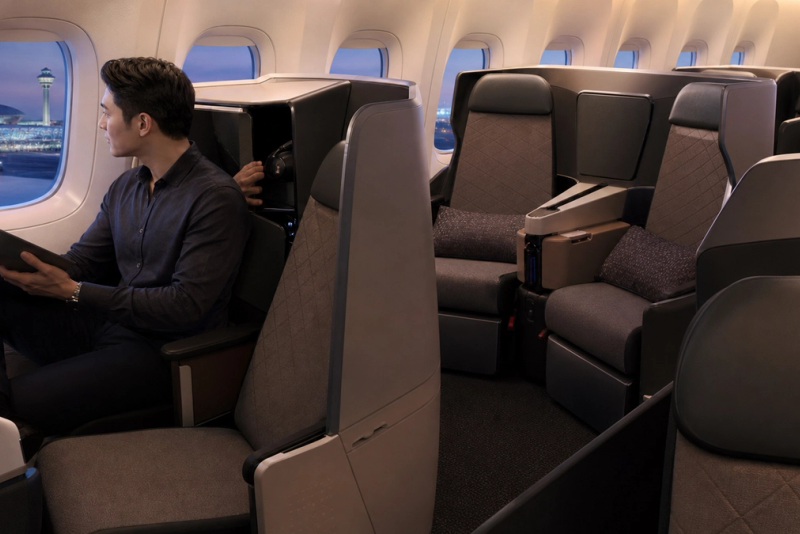 Traveller comparing direct-aisle seat types in a next-generation business-class cabin