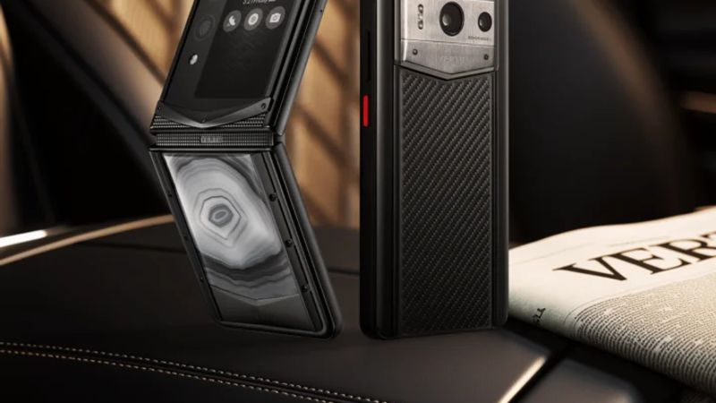 A person holding a smartphone, taking a photo of a detailed object, highlighting the camera's capability.