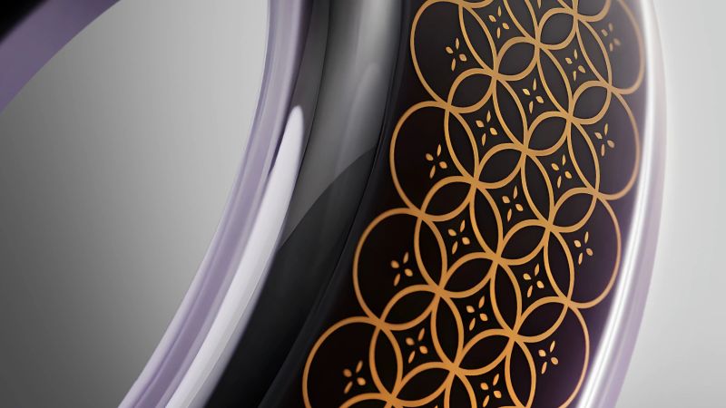A close-up of a luxury smart health ring featuring intricate design details