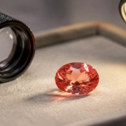 Pink-orange padparadscha sapphire assessed for colour, treatment, cut and certification