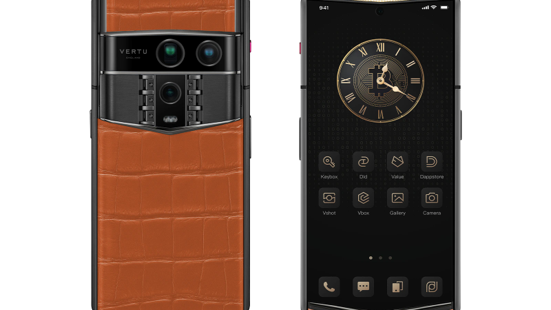 A vibrant orange smart ring presented in its luxury packaging.