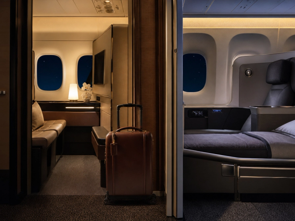 A first-class suite and business-class flat-bed cabin shown side by side on a long-haul aircraft