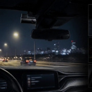 Dash-camera installation showing front and rear coverage in a premium car